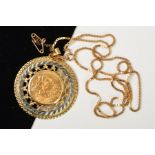 A SOVEREIGN PENDANT, the 1911 full sovereign within a fancy tiered, partly openwork surround