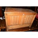 AN OAK LINENFOLD BLANKET CHEST with a single drawer