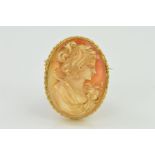 A 9CT GOLD CAMEO BROOCH, of oval outline depicting a lady in profile to the double rope twist
