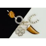 FOUR THOMAS SABO CHARMS AND A CHARM CARRIER, to include two tiger's eye charms, a quatrefoil cubic
