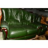 A GREEN LEATHER TWO PIECE LOUNGE SUITE, comprising a two seater settee and an armchair