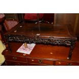 A 20TH CENTURY FRUITWOOD COFFEE TABLE with carved grape and fruiting vine apron to each side,