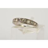 AN EARLY 20TH CENTURY SEVEN STONE DIAMOND RING, designed as a graduated line of brilliant cut