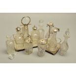 A LATE VICTORIAN/EDWARDIAN FOUR BOTTLE CRUET, together with another with six bottles, both with