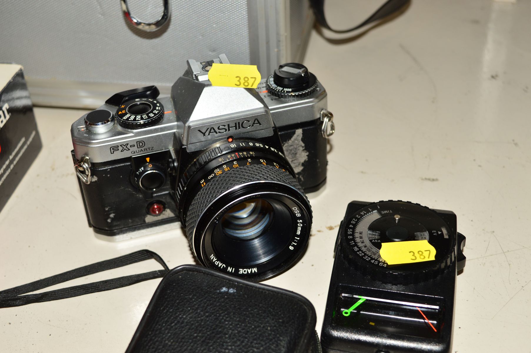 A YASHICA FX-D FILM SLR CAMERA, fitted with a 50mm f1.9 lens, a Yashica ML 35mm f2.8 lens, an Elicar - Image 2 of 3