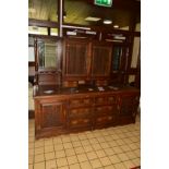 A LARGE EDWARDIAN OAK DRESSER, the upper section with double bevelled glazed doors above flanked