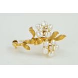 A FRESHWATER CULTURED PEARL AND DIAMOND FLOWER BROOCH, designed as two flowers with freshwater