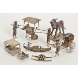 A CHINESE SILVER MODEL OF TWO FIGURES CARRYING A SEDAN CHAIR, bears marks including SW, length 12cm,
