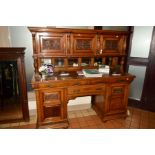 A LATE VICTORIAN OAK DRESSER, moulded cornice above four fluted columns divided by three cupboards