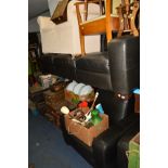 A CHARCOAL LEATHER THREE PIECE SUITE comprising a three seater settee, two seater setee and an