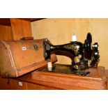 A WALNUT SINGER SEWING MACHINE