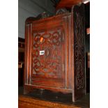 AN EDWARDIAN CARVED MAHOGANY SINGLE DOOR SMOKERS CABINET