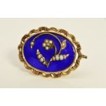 A MID VICTORIAN GOLD MEMORIAL BROOCH, blue enamel inlaid with floral seed pearl detail, oval shape