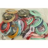 FORTY ENDLESS JEWELLERY LEATHER BRACELETS AND CHARMS, in varying colours, to include red, blue,