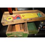 A VINTAGE PINE CASED CRAZY GOLF SET together with a green painted pine crate, a hanging single
