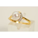 A MODERN 18CT GOLD DIAMOND AND CULTURED PEARL DRESS RING, centering on a single akoya cultured pearl