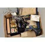 A SMALL BOX OF COSTUME JEWELLERY to include a hinged jewellery box, a Coalbrook china flower brooch,