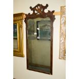 A 19TH CENTURY MAHOGANY WALL MIRROR, with a carved Eagle to the top, (s.d.) and two other wall