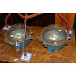 A PAIR OF VINTAGE BLUE PAINTED ANTI EXPLOSION WALL LIGHTS