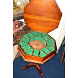 A REPRODUCTION MAHOGANY AND INLAID OCTAGONAL TRUMPET SEWING/GAMES TABLE, on triple legs