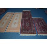 A MODERN WOOLLEN RED GROUND CARPET RUNNER, width 272cm together with a matching rug, and a pair of