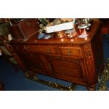 A 20TH CENTURY OAK SIDEBOARD with a raised back above two short and one long drawer and two panelled