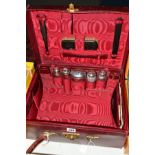 AN EARLY 20TH CENTURY RED LEATHER GENTLEMAN'S DRESSING CASE, red silk lined, fitted with many