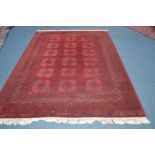 A LATE 20TH CENTURY TEKKE STYLE RED GROUND CARPET SQUARE, 295cm x 201cm (low pile)