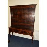 A REPRODUCTION GEORGIAN STYLE OAK DRESSER, the top section with triple plate rack above a base