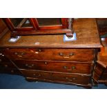 A GEORGIAN OAK CHEST OF THREE LONG DRAWERS with swan neck handles, on bracket feet, width 95cm x