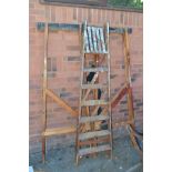 TWO PINE TRESTLE STANDS TOGETHER WITH WOODEN STEP LADDERS (3)