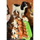 SEVEN BESWICK DOGS to include Cocker Spaniel 'Horseshoe Primula' No967, five dog ashtray No869, 'Dog