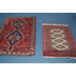 A 20TH CENTURY BOKARA STYLE RED GROUND RUG, 162cm x 110cm together with another bokara rug (2)
