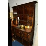 AN EARLY 20TH CENTURY OAK DRESSER, with two central drawers, width 153cm x depth 52.5cm x height