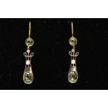 A PAIR OF PERIDOT AND DIAMOND EARRINGS, each designed as an oval peridot cabochon to the tapered,