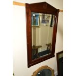 A REPRODUCTION MAHOGANY BEVELLED EDGE OVERMANTEL MIRROR, together with a gilt framed oval mirror (