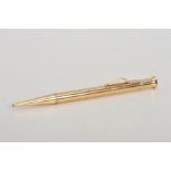 A 9CT GOLD 'THE MASCOT' RETRACTABLE PENCIL, the plain case with tapered terminal, with 9ct
