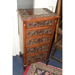 AN EARLY 20TH CENTURY CARVED OAK CHEST OF FIVE SHORT DRAWERS, ring handles, on four cabriole legs,