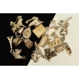 TWENTY LOOSE CHARMS, to include a hinged church, bible, tankard, water mill, boot, bull fighter etc,