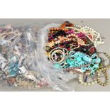 A LARGE BAG OF COSTUME JEWELLERY, to include mainly necklaces, some a/f