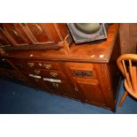 AN EDWARDIAN WALNUT SIDEBOARD with two central drawers, width 151cm x depth 56cm x height 94cm and a