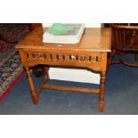 A REPRODUCTION GOLDEN OAK SIDE TABLE, with a single drawer, width 79cm x depth 46cm x height 69cm