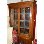 A GEORGIAN MAHOGANY ASTRAGAL GLAZED DOUBLE DOOR CORNER CUPBOARD, painted interior above a double