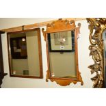 A 20TH CENTURY FOLIATE DECORATED WALNUT WALL MIRROR, together with two mirrors (3)