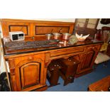 A LATE 19TH/EARLY 20TH CENTURY POLLARD OAK AND EBONISED BANDED PEDESTAL SIDEBOARD, with a raised