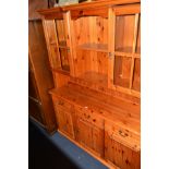 A MODERN PINE GLAZED DRESSER, with three drawers, width 141cm x depth 40cm x height 185cm