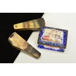 AN ENAMEL SNUFF BOX AND TWO HORN HORSESHOE STONE REMOVAL TOOLS, the enamel snuff box of