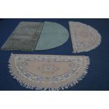 A PAIR OF WOOLLEN CREAM HALF MOON RUGS, together with two other rugs (4)