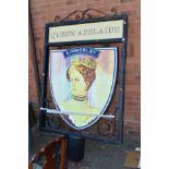 A LARGE BLACK PAINTED STEEL AND WROUGHT IRON PILLAR TOP PUB WELCOME SIGN, reading 'Queen Adelaide'