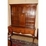 A REPRODUCTION GEORGIAN STYLE OAK DRESSER, the top section with an arrangement of plate rack